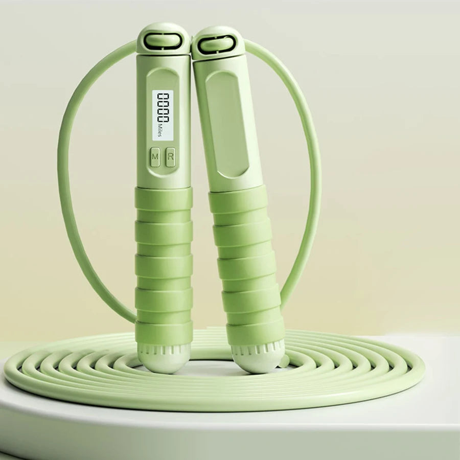 Smart jump rope with digital counter in light green featuring ergonomic grips and LED display
