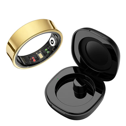 Aura smart ring in gold with black charging case showing internal electronic components