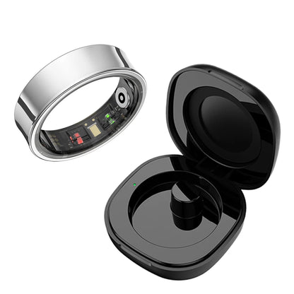 Aura smart ring with sleek silver design and black wireless charging case