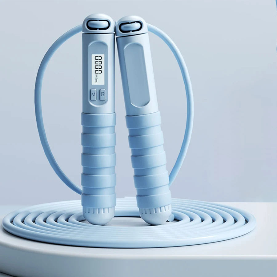 Smart jump rope with digital counter in light blue featuring ergonomic handles and LCD display