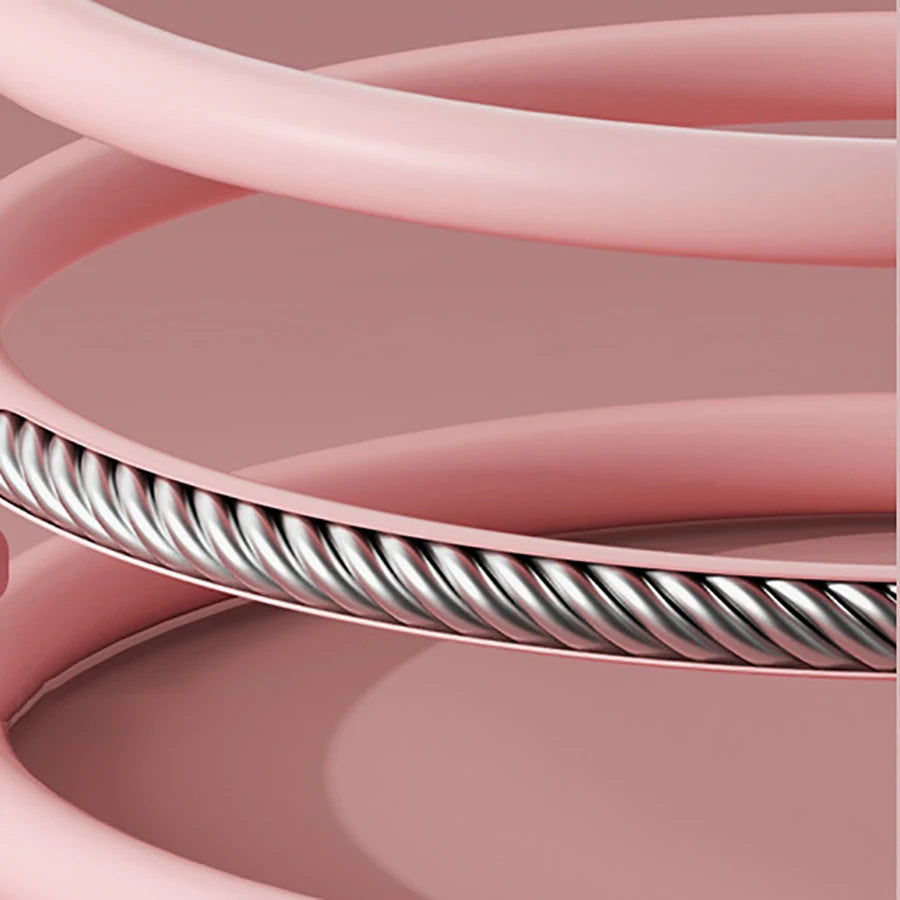 Close-up of smart jump rope with digital counter showing durable twisted metal cable and pink handles