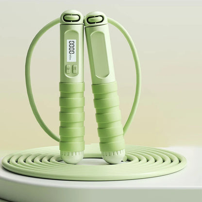 Smart jump rope with digital counter in light green featuring ergonomic grips and LED display